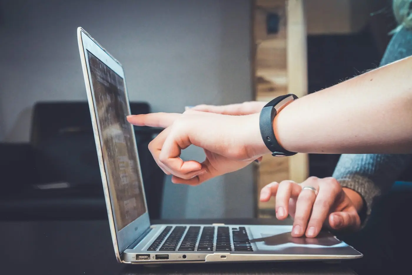 Reviewing a website on a laptop together